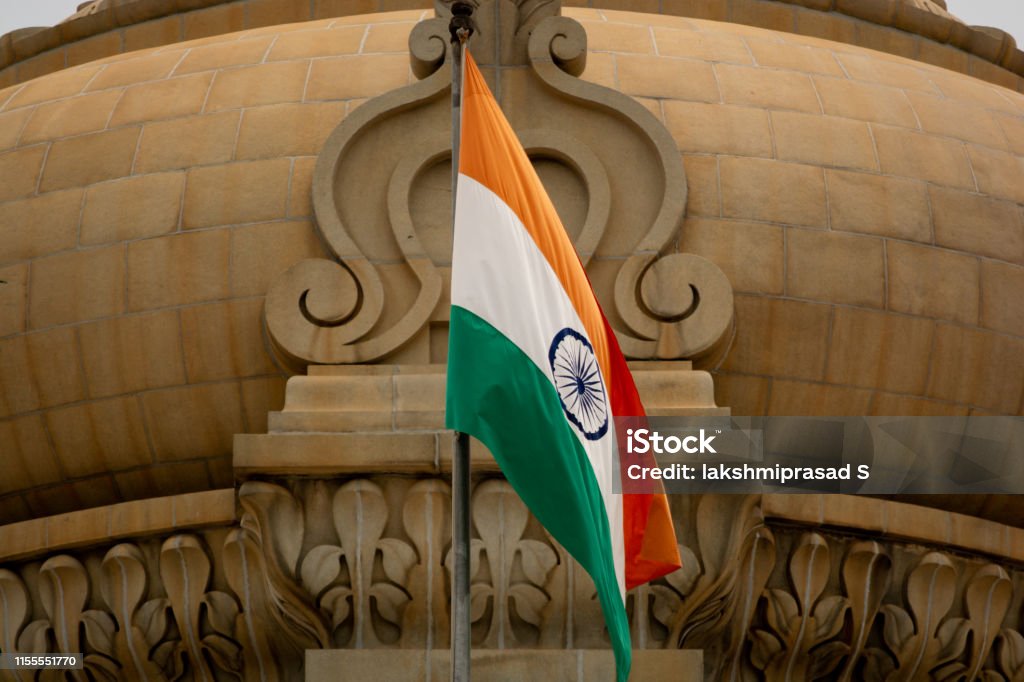 Closeup of Indian Flag waving on the dome of Vidhana Soudha at Bangaluru, India Closeup of Indian Flag waving on the dome of Vidhana Soudha at Bangaluru, India. Indian Flag Stock Photo