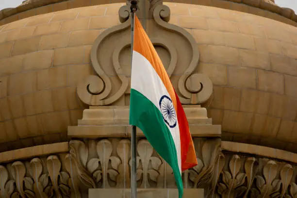 Photo of Closeup of Indian Flag waving on the dome of Vidhana Soudha at Bangaluru, India