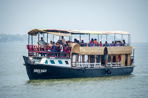Marine drive, Kochin, Kerala, India - April 3, 2016: Peoples traveling on boat at Marine drive Kochin