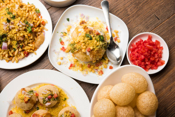Bombay Chat food in group group of Bombay chat food includes golgappa/panipuri, bhel-puri, sev-poori, dahipuri, Ragda pattice, raj kachori etc. selective focus raj kachori stock pictures, royalty-free photos & images