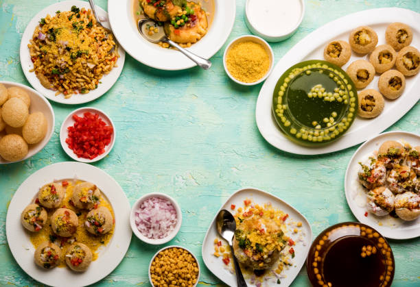 Bombay Chat food in group group of Bombay chat food includes golgappa/panipuri, bhel-puri, sev-poori, dahipuri, Ragda pattice, raj kachori etc. selective focus raj kachori stock pictures, royalty-free photos & images