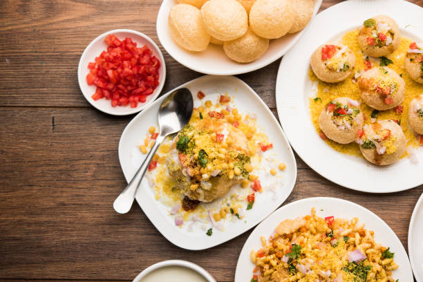Bombay Chat food in group group of Bombay chat food includes golgappa/panipuri, bhel-puri, sev-poori, dahipuri, Ragda pattice, raj kachori etc. selective focus raj kachori stock pictures, royalty-free photos & images