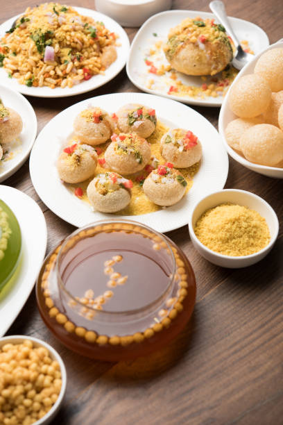 Bombay Chat food in group group of Bombay chat food includes golgappa/panipuri, bhel-puri, sev-poori, dahipuri, Ragda pattice, raj kachori etc. selective focus raj kachori stock pictures, royalty-free photos & images