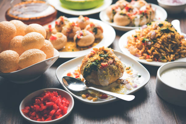 Bombay Chat food in group group of Bombay chat food includes golgappa/panipuri, bhel-puri, sev-poori, dahipuri, Ragda pattice, raj kachori etc. selective focus raj kachori stock pictures, royalty-free photos & images