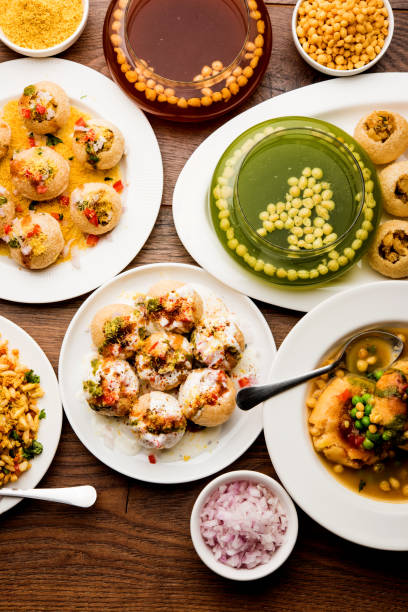 Bombay Chat food in group group of Bombay chat food includes golgappa/panipuri, bhel-puri, sev-poori, dahipuri, Ragda pattice, raj kachori etc. selective focus raj kachori stock pictures, royalty-free photos & images