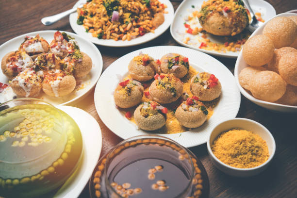 Bombay Chat food in group group of Bombay chat food includes golgappa/panipuri, bhel-puri, sev-poori, dahipuri, Ragda pattice, raj kachori etc. selective focus raj kachori stock pictures, royalty-free photos & images