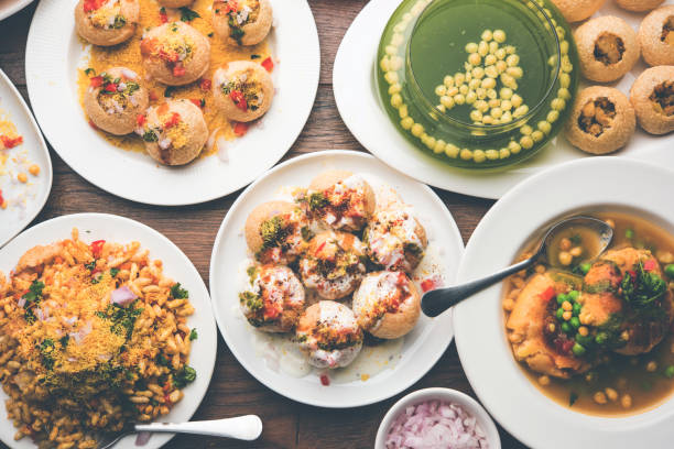 Bombay Chat food in group group of Bombay chat food includes golgappa/panipuri, bhel-puri, sev-poori, dahipuri, Ragda pattice, raj kachori etc. selective focus raj kachori stock pictures, royalty-free photos & images