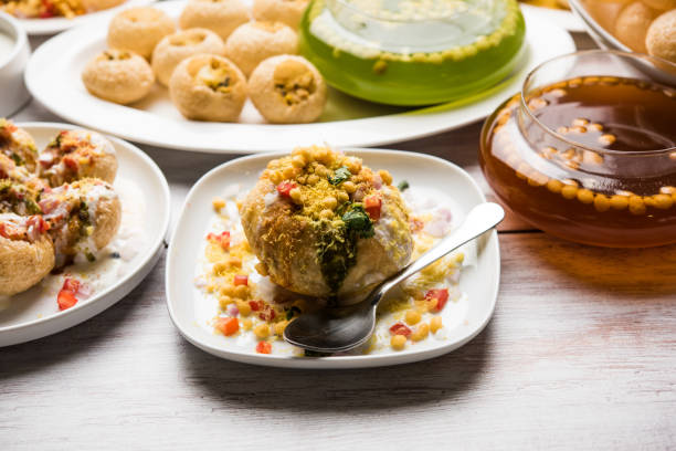 Bombay Chat food in group group of Bombay chat food includes golgappa/panipuri, bhel-puri, sev-poori, dahipuri, Ragda pattice, raj kachori etc. selective focus raj kachori stock pictures, royalty-free photos & images