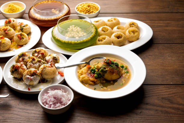 Bombay Chat food in group group of Bombay chat food includes golgappa/panipuri, bhel-puri, sev-poori, dahipuri, Ragda pattice, raj kachori etc. selective focus raj kachori stock pictures, royalty-free photos & images