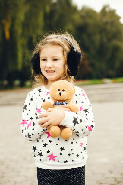 istock Cute child in a park playing on a grass 1155560534