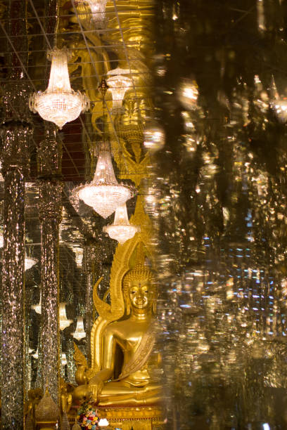 istock Golden Buddha, statue in cathedral glass. 1155562125