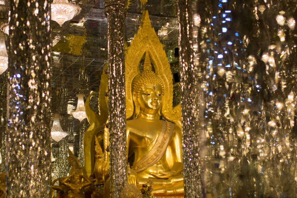 istock Golden Buddha, statue in cathedral glass. 1155563794