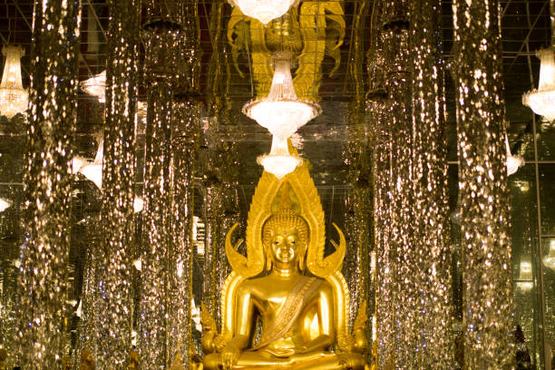 istock Golden Buddha, statue in cathedral glass. 1155563810