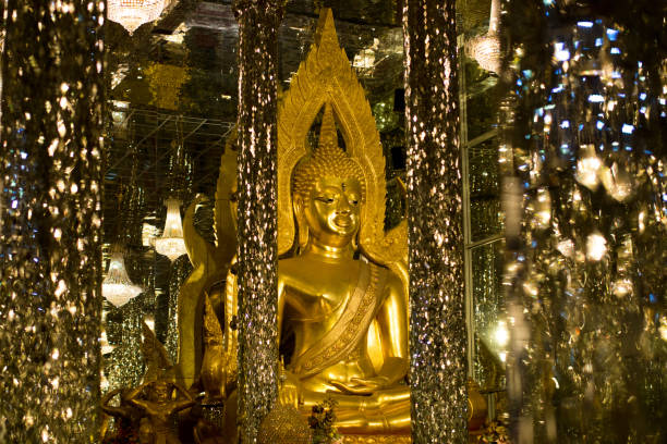 istock Golden Buddha, statue in cathedral glass. 1155563837