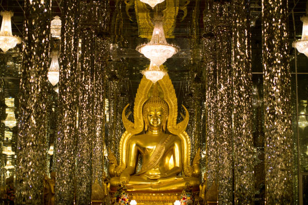 istock Golden Buddha, statue in cathedral glass. 1155563931
