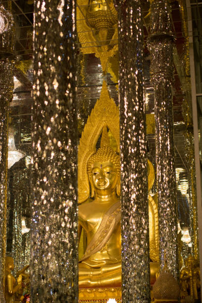 istock Golden Buddha, statue in cathedral glass. 1155564214