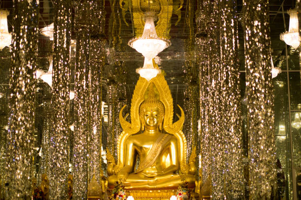 istock Golden Buddha, statue in cathedral glass. 1155564975