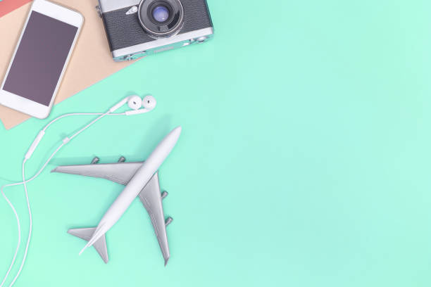 istock Travel accessories objects and gadgets top view flatlay on blue pastel 1155565982
