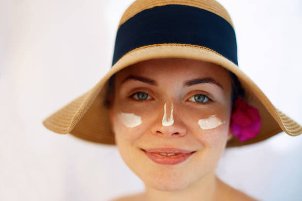 istock Suntan Lotion Woman Applying Sunscreen. Solar Cream. 1155568731
