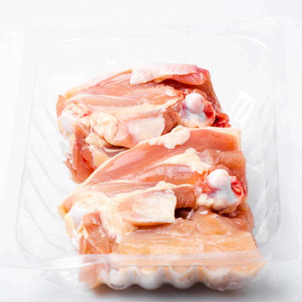 istock Chicken thighs in plastic pack from supermarket, ready to cook. 1155570105