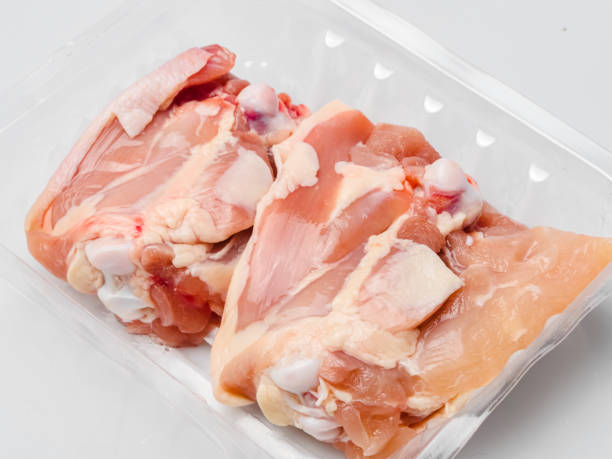 istock Chicken thighs in plastic pack from supermarket, ready to cook. 1155570156