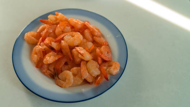 istock boiled shrimps lie in a plate on the table 1155573033