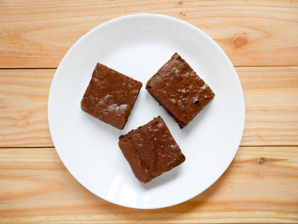Homemade chocolate brownies on a white plate