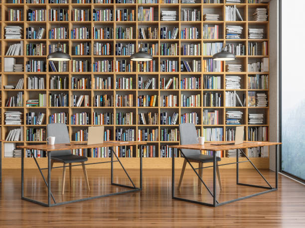 istock Laptop on a desk in library 1155578227
