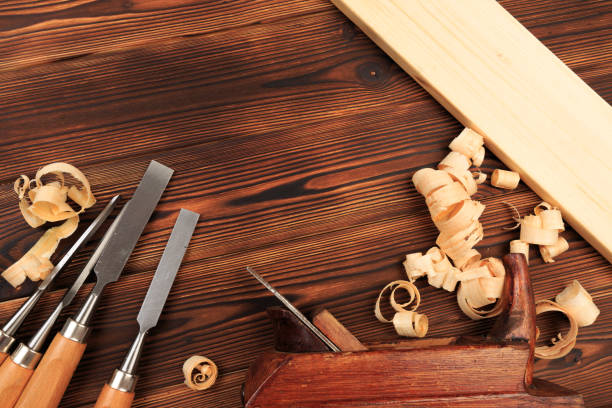 istock chisels plane and sawdust on a wooden table - Image 1155578245
