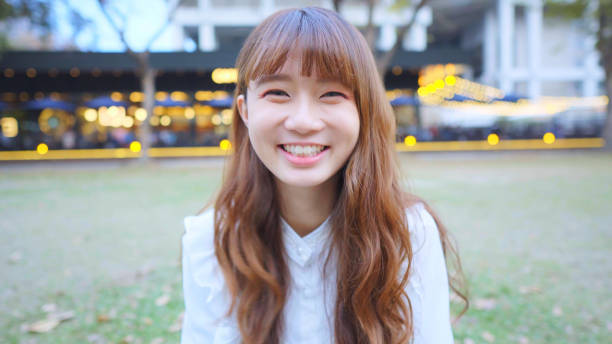istock Young Woman Looking At Camera 1155580109