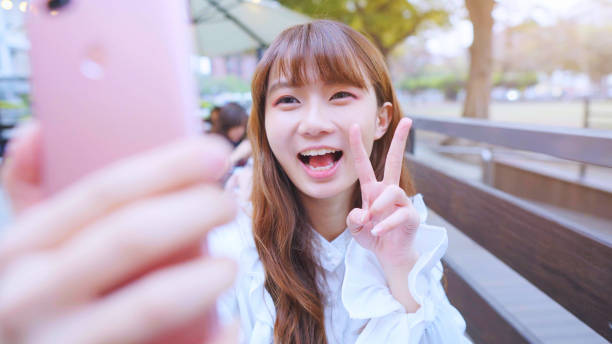 istock Young Woman Smile Take Selfie 1155580127