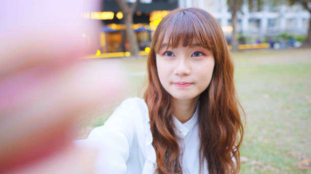 istock Young Woman Smile Take Selfie 1155580179