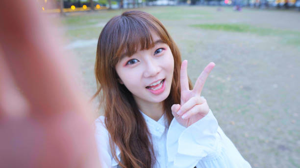 istock Young Woman Smile Take Selfie 1155580188