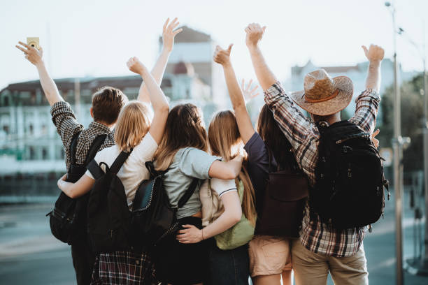 istock People with backpacks on city background 1155580274