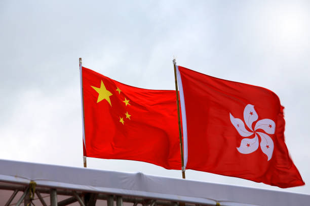 istock china and hong kong flag waving 1155583003