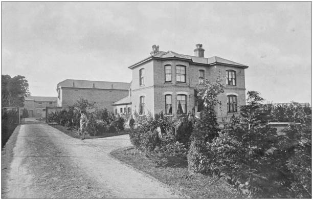 istock Antique vintage black and white photo: British countryside house 1155584128