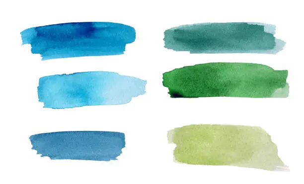 Photo of Set of green and blue colorful watercolor blot on white background. The color splashing in the paper. It is a hand drawn picture