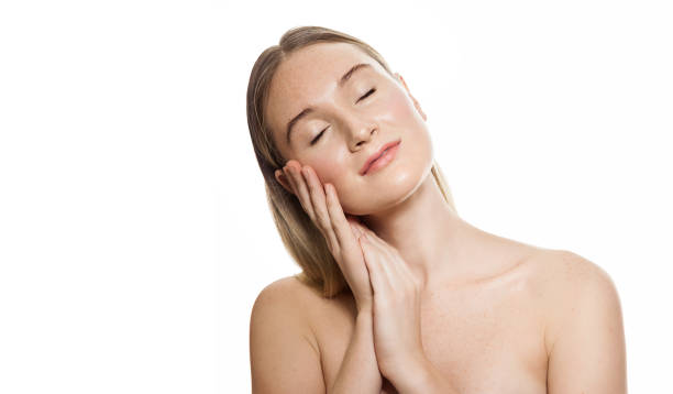 istock Beautiful spa woman touching her face 1155584686