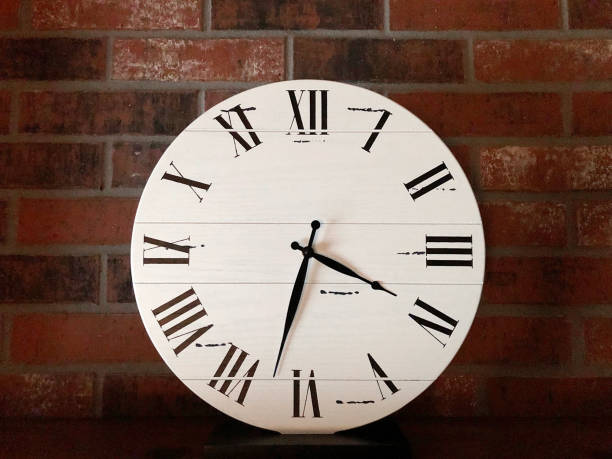 istock Roman Numeral Farmhouse Clock 1155585673