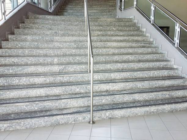 istock Marble staircase, with central railing in chromed metal 1155589033