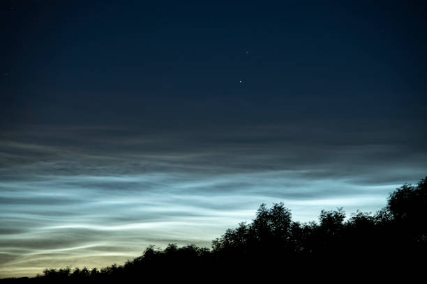 istock Noctilucent clouds or night shining clouds in the dark night sky 1155590960