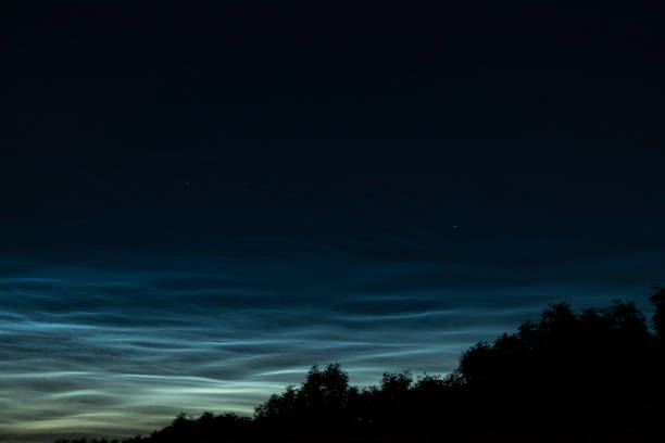 istock Noctilucent clouds or night shining clouds in the dark night sky 1155591123