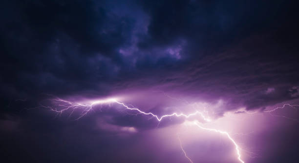 istock Lightning in the dark night sky during a summer thunderstorm 1155591184