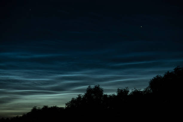 istock Noctilucent clouds or night shining clouds in the dark night sky 1155591267