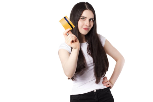 istock Black haired young woman with a credit card 1155592484