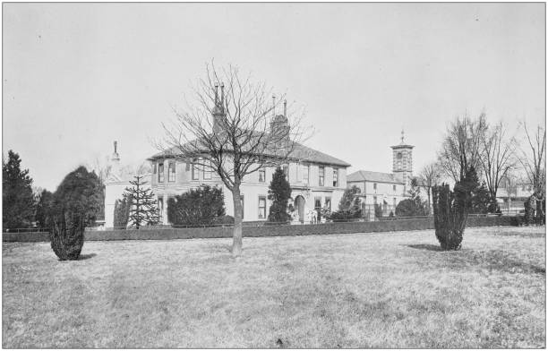istock Antique vintage black and white photo: British countryside house 1155593623