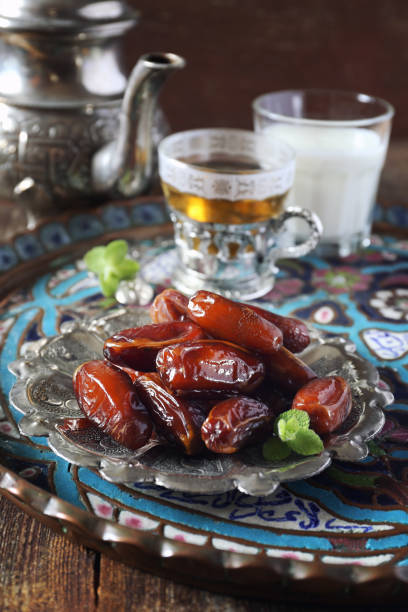 istock Ripe dates, green tea and fermented milk drink 1155593757
