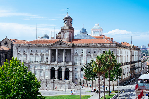 People are visiting the town square. Porto City Hall (Pacos do Concelho) and City Sign - Porto, Portugal.