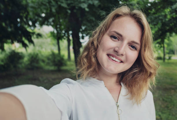 istock Young woman extending her arm to the camera 1155594791