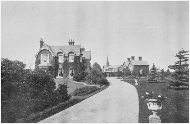 istock Antique vintage black and white photo: British countryside house 1155595498